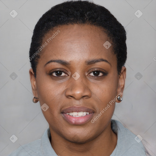 Joyful black young-adult female with short  black hair and brown eyes