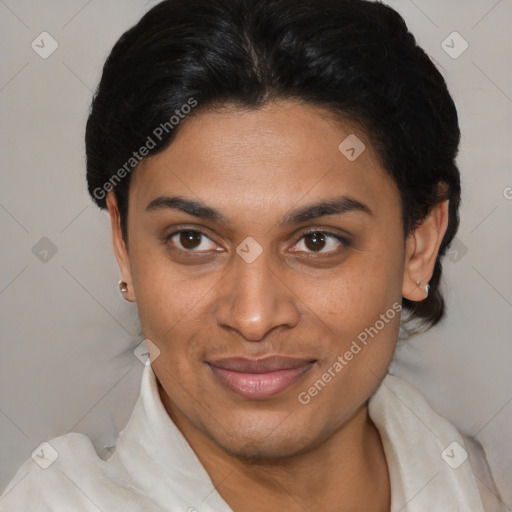 Joyful latino young-adult female with short  brown hair and brown eyes