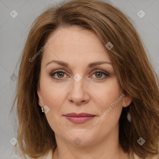 Joyful white adult female with medium  brown hair and brown eyes