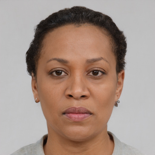 Neutral black adult female with short  brown hair and brown eyes