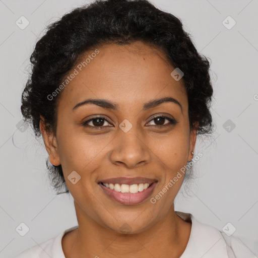 Joyful latino young-adult female with short  black hair and brown eyes