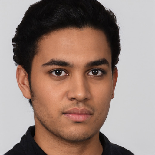 Neutral latino young-adult male with short  black hair and brown eyes