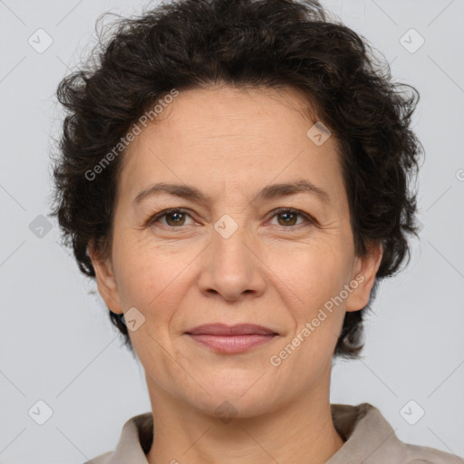 Joyful white adult female with short  brown hair and brown eyes