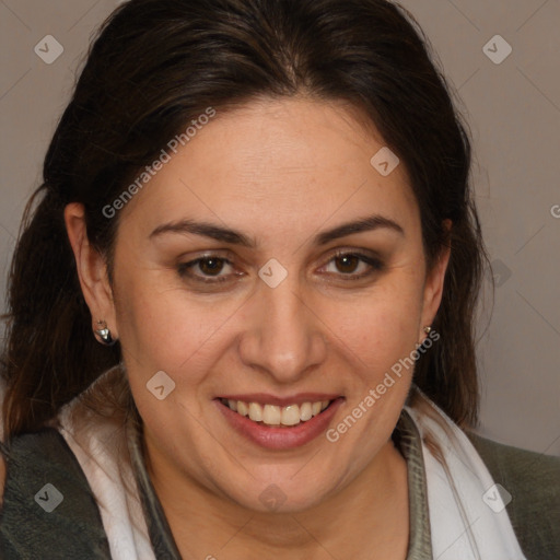 Joyful white adult female with medium  brown hair and brown eyes