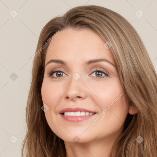 Joyful white young-adult female with long  brown hair and brown eyes