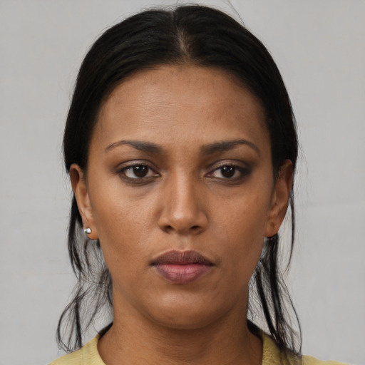 Neutral latino young-adult female with medium  black hair and brown eyes