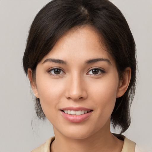 Joyful white young-adult female with medium  brown hair and brown eyes