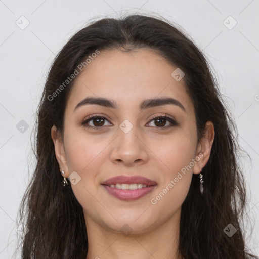 Joyful latino young-adult female with long  brown hair and brown eyes