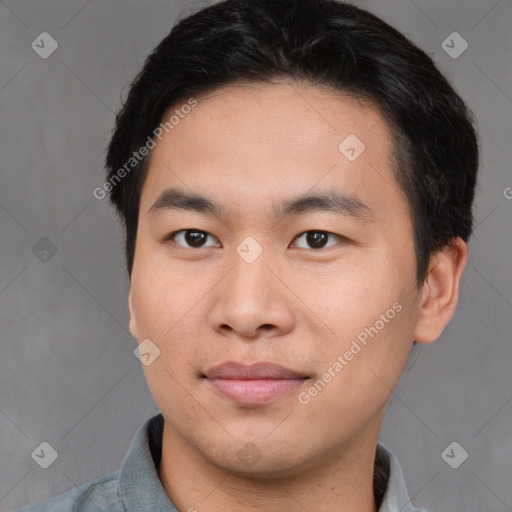 Joyful asian young-adult male with short  brown hair and brown eyes