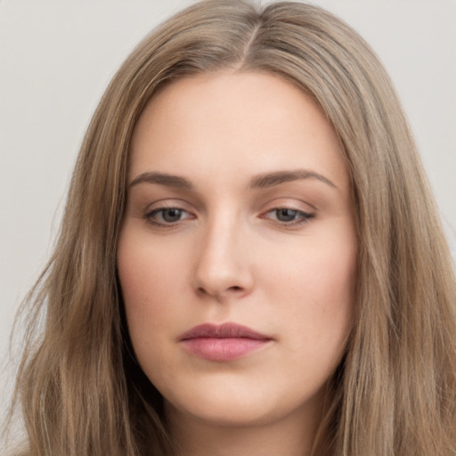 Neutral white young-adult female with long  brown hair and brown eyes