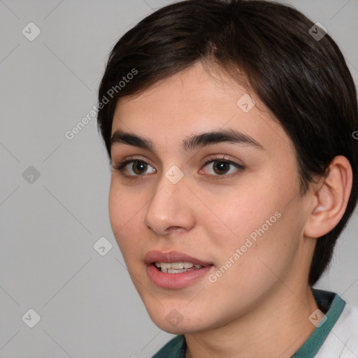 Joyful white young-adult female with short  brown hair and brown eyes