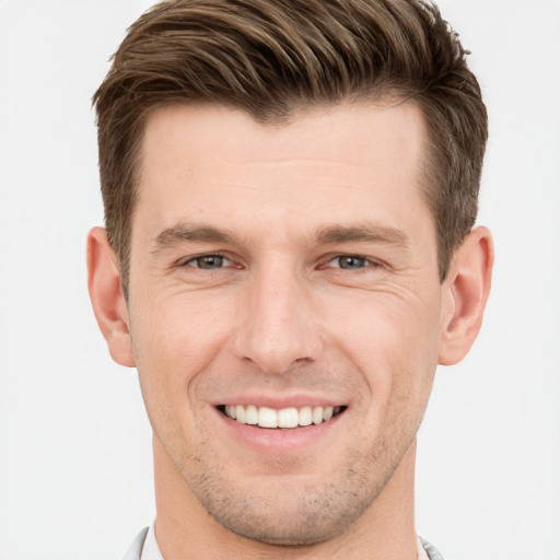 Joyful white young-adult male with short  brown hair and brown eyes