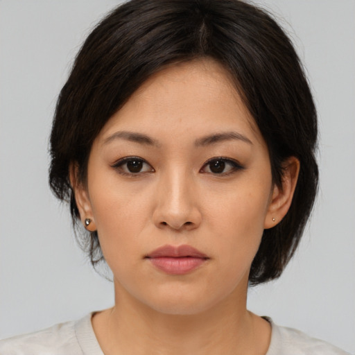 Neutral asian young-adult female with medium  brown hair and brown eyes