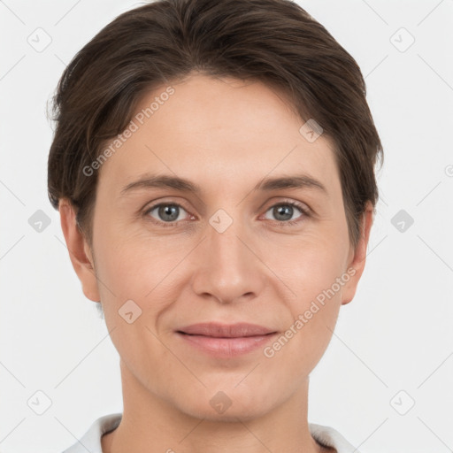 Joyful white young-adult female with short  brown hair and grey eyes