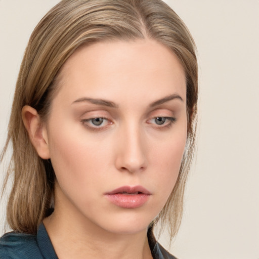 Neutral white young-adult female with long  brown hair and blue eyes