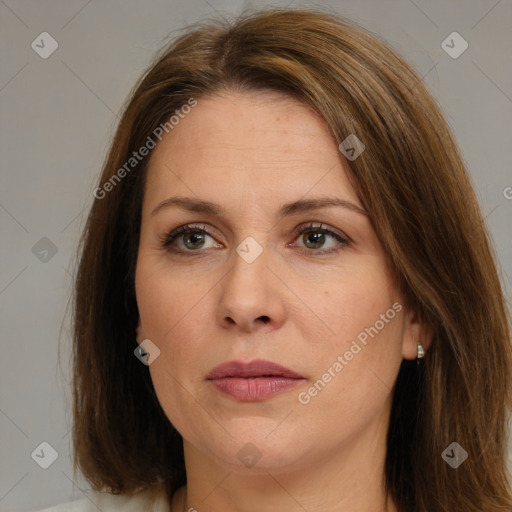 Joyful white adult female with medium  brown hair and brown eyes