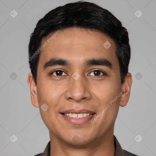 Joyful white young-adult male with short  black hair and brown eyes