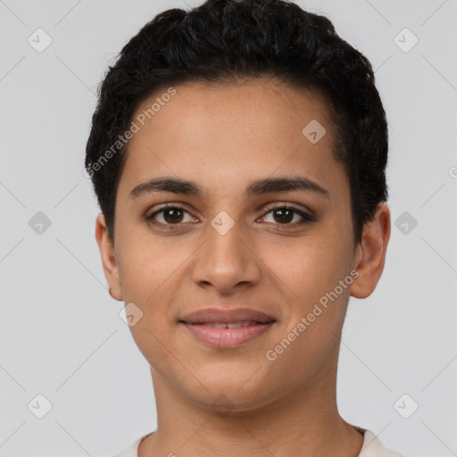 Joyful latino young-adult female with short  black hair and brown eyes