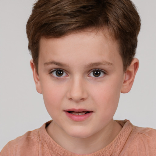 Joyful white child male with short  brown hair and brown eyes