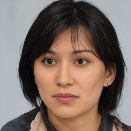 Neutral asian young-adult female with medium  brown hair and brown eyes