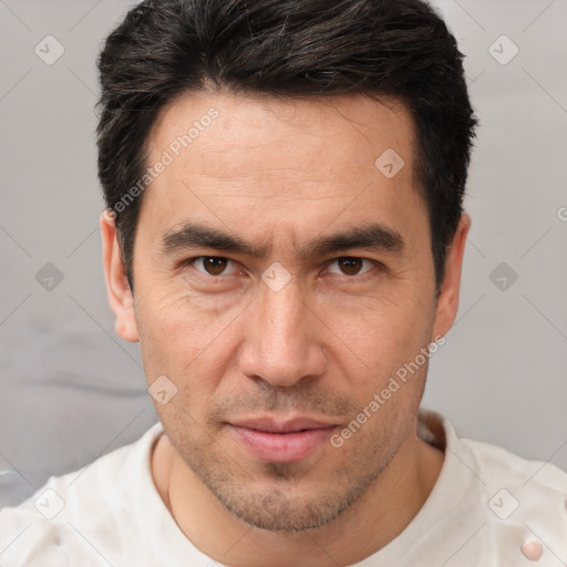 Joyful white adult male with short  brown hair and brown eyes