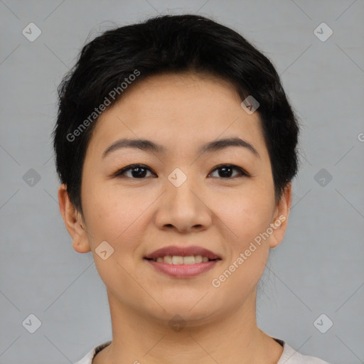 Joyful asian young-adult female with short  brown hair and brown eyes