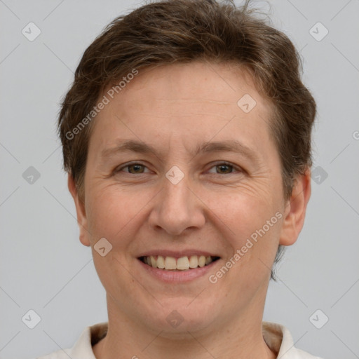 Joyful white adult female with short  brown hair and grey eyes