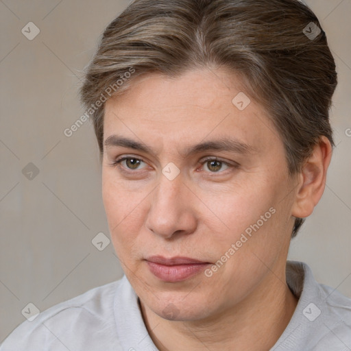 Joyful white adult female with short  brown hair and brown eyes