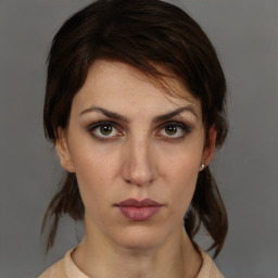 Neutral white young-adult female with medium  brown hair and brown eyes