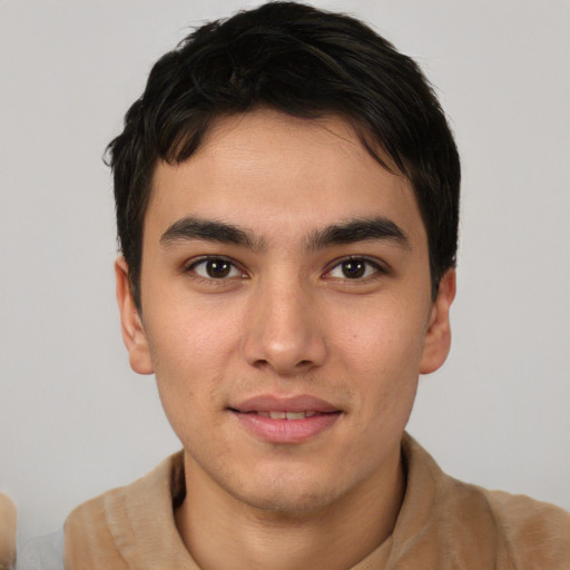 Joyful asian young-adult male with short  brown hair and brown eyes