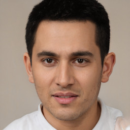 Joyful white young-adult male with short  black hair and brown eyes