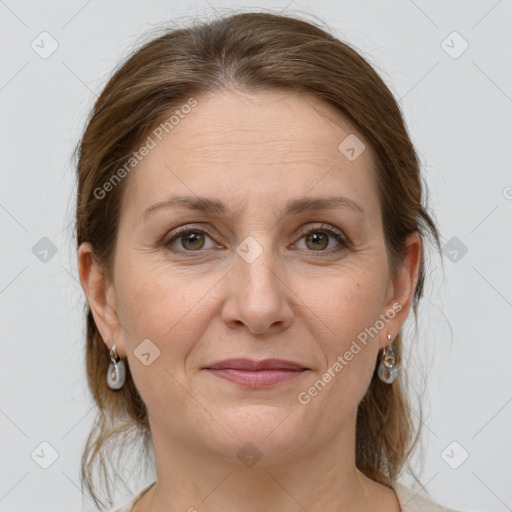 Joyful white adult female with medium  brown hair and grey eyes