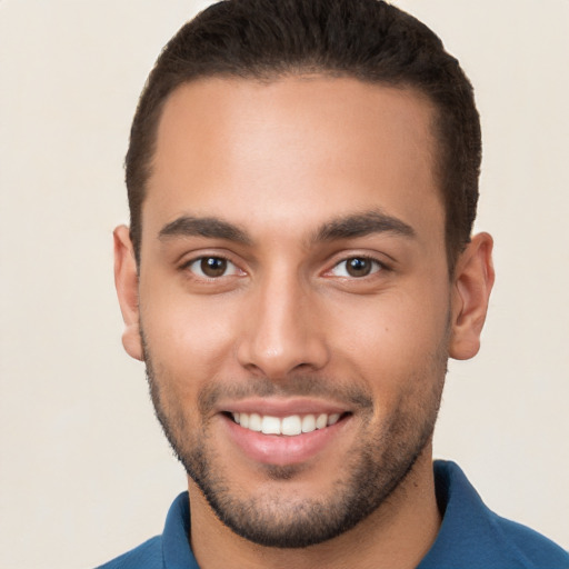 Joyful white young-adult male with short  brown hair and brown eyes