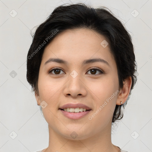 Joyful asian young-adult female with short  brown hair and brown eyes