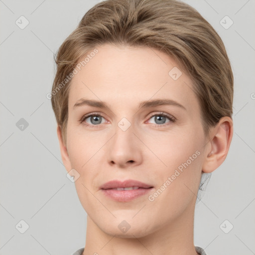 Joyful white young-adult female with short  brown hair and grey eyes