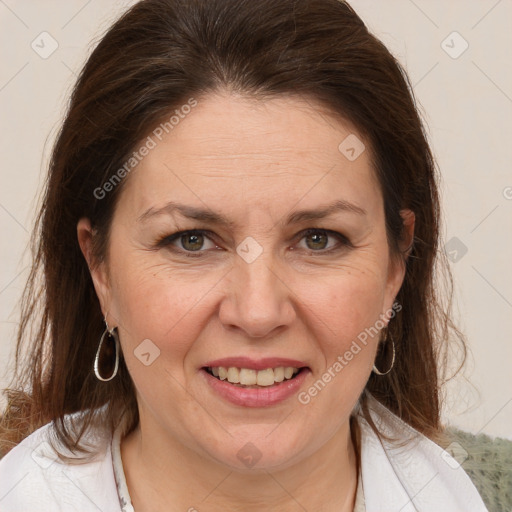 Joyful white adult female with medium  brown hair and brown eyes