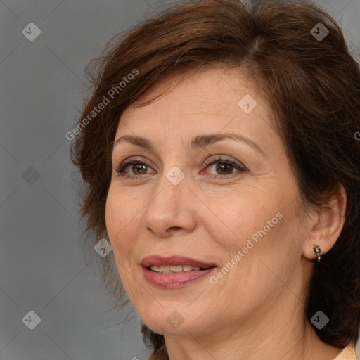 Joyful white adult female with medium  brown hair and brown eyes