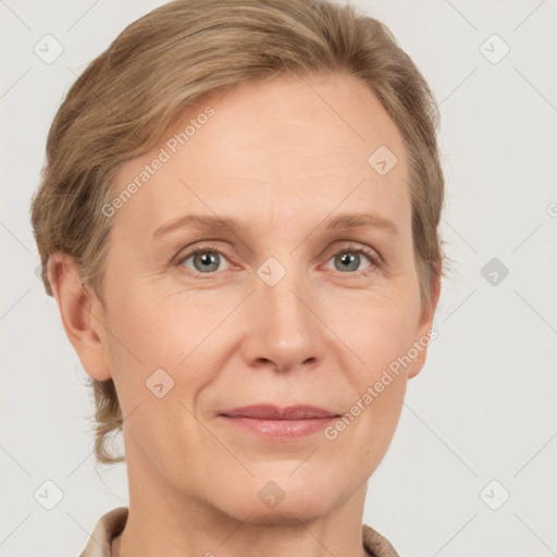 Joyful white adult female with short  brown hair and grey eyes