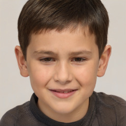 Joyful white child male with short  brown hair and brown eyes