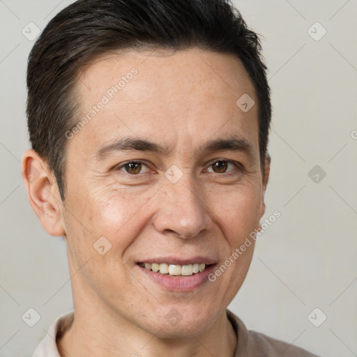 Joyful white adult male with short  brown hair and brown eyes