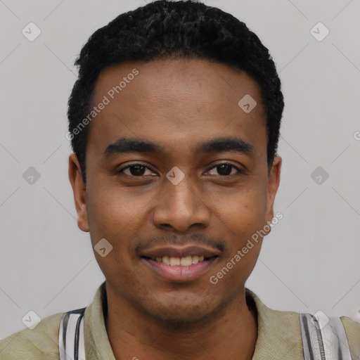 Joyful black young-adult male with short  black hair and brown eyes