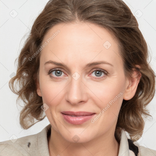 Joyful white young-adult female with medium  brown hair and blue eyes