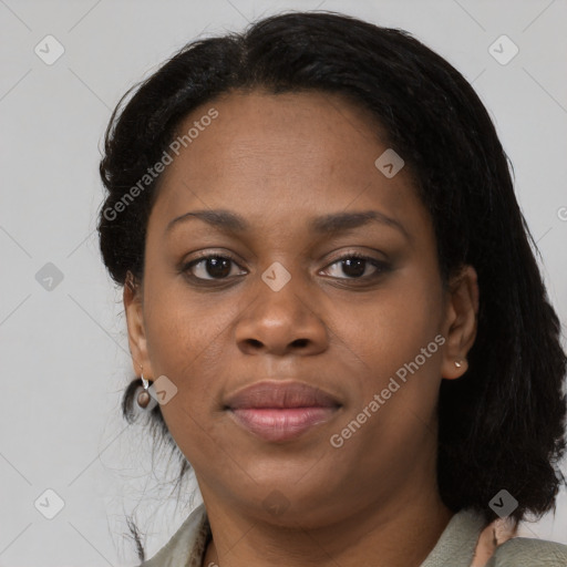 Joyful black young-adult female with medium  brown hair and brown eyes