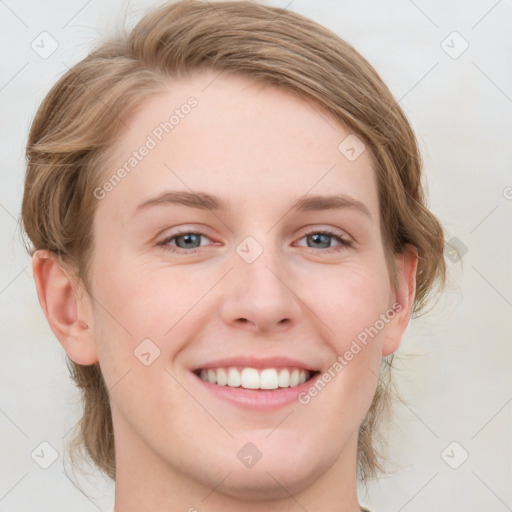 Joyful white young-adult female with medium  brown hair and blue eyes