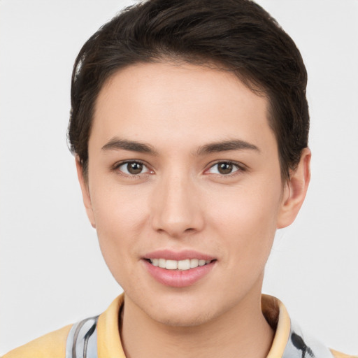 Joyful white young-adult female with short  brown hair and brown eyes