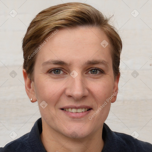 Joyful white adult female with short  brown hair and grey eyes