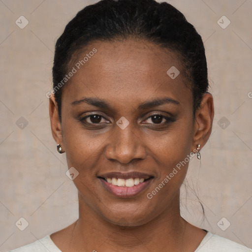 Joyful black young-adult female with short  black hair and brown eyes