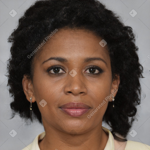 Joyful black adult female with medium  brown hair and brown eyes