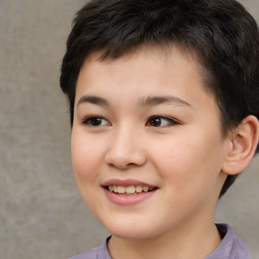 Joyful white child female with short  brown hair and brown eyes