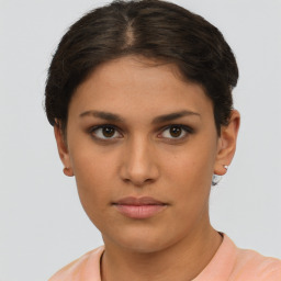 Neutral white young-adult female with short  brown hair and brown eyes